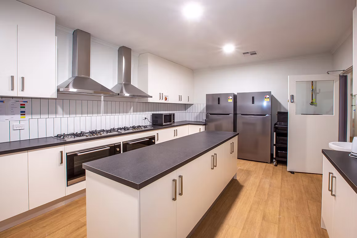 Modern childcare centre kitchen with stainless steel rangehoods