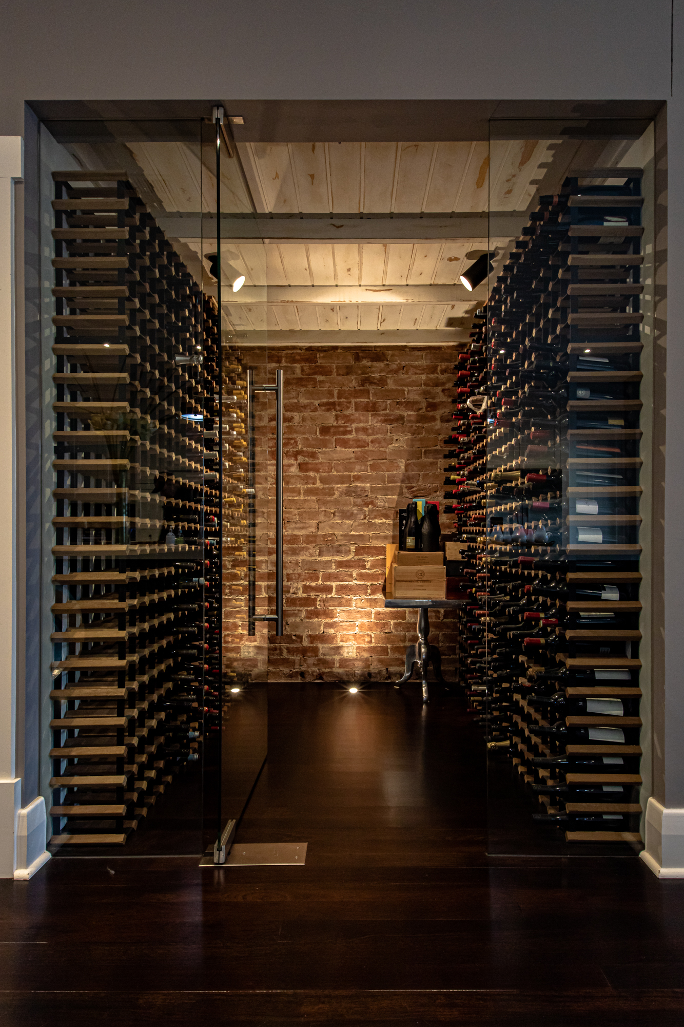 Built-in wine cellar with brick feature wall in Unley Park
