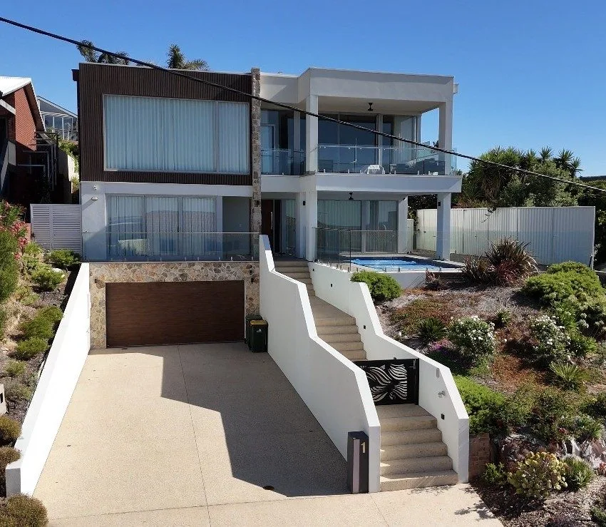 Coastal architectural home with swimming pool built by build solutions