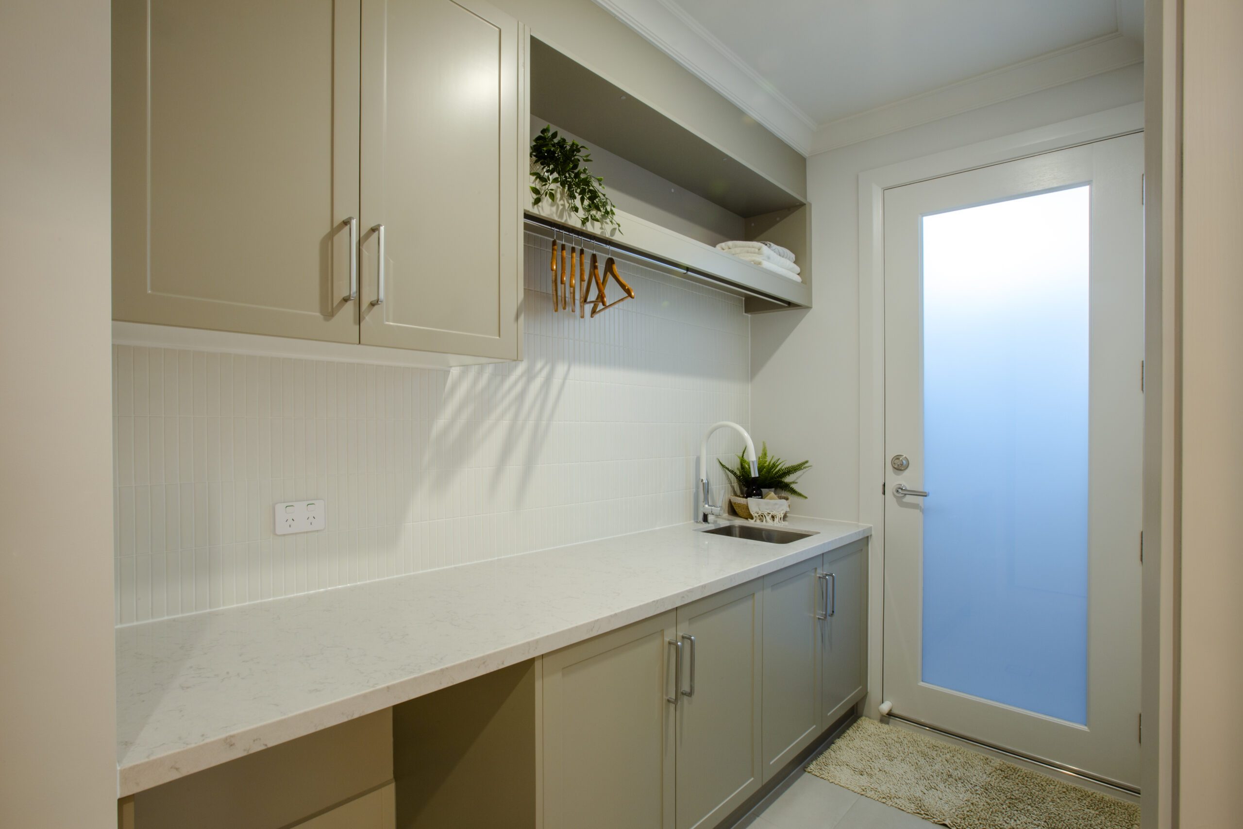 Laundry in Oasis display home by Built Solutions at Aston Park