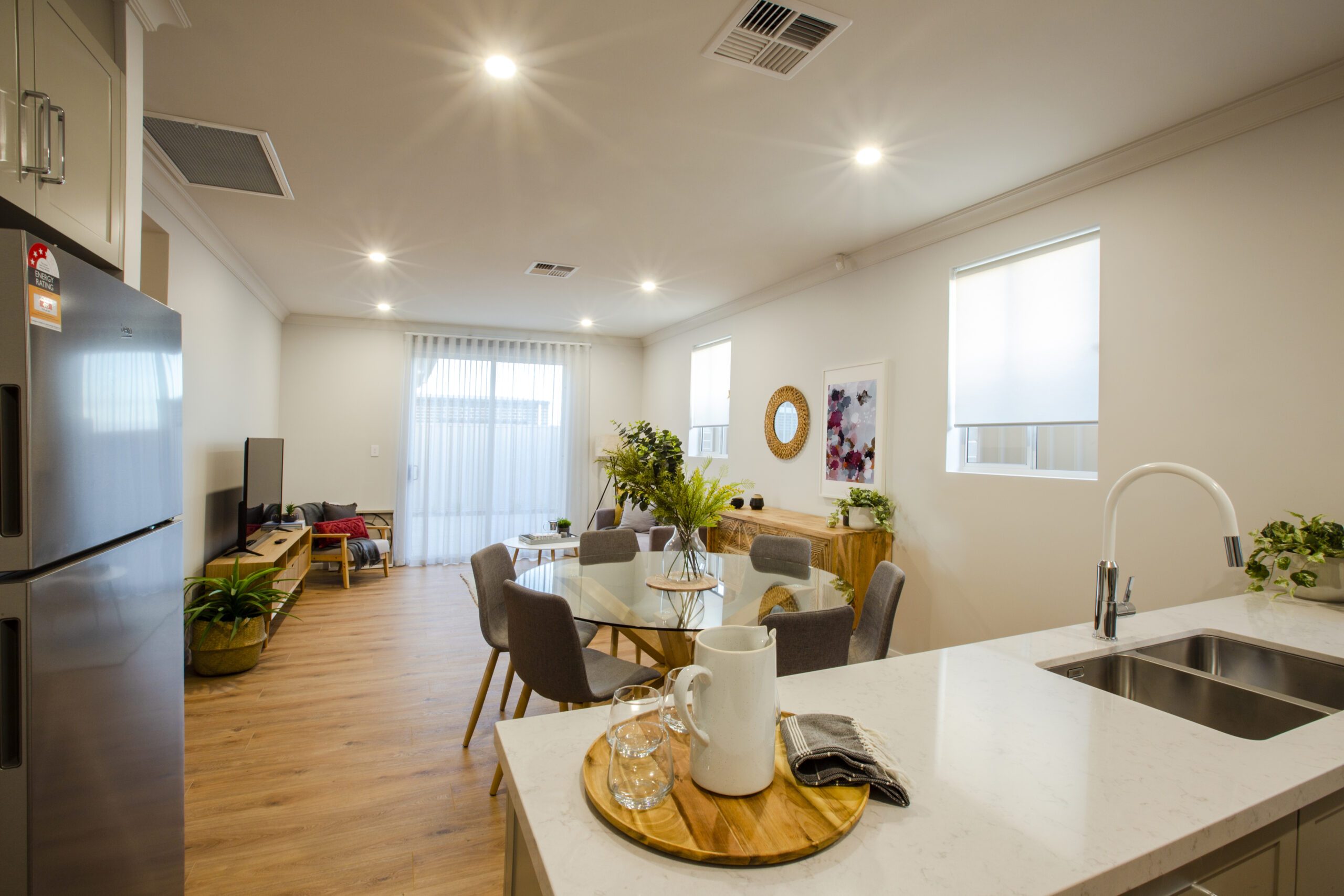Open-plan kitchen and living area in Oasis display home by Built Solutions at Aston Park
